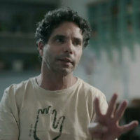 Released hostage Ofer Calderon gestures during an interview broadcast on Channel 12, July 4, 2025. (Screen capture: Channel 12)